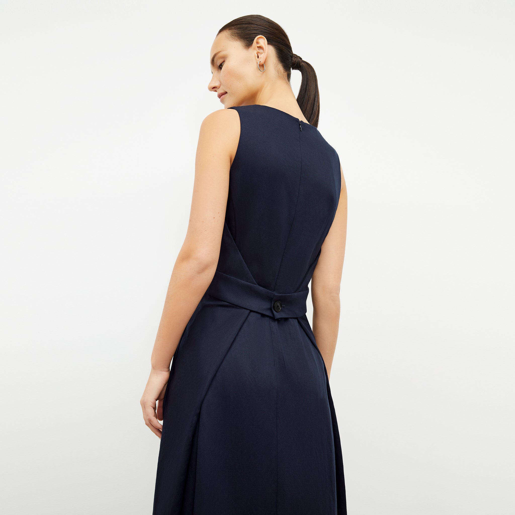 Back image of a woman wearing the Estela Dress in Night