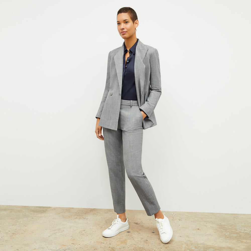 Front image of a woman wearing the Mejia Pant in Black and White Sharkskin