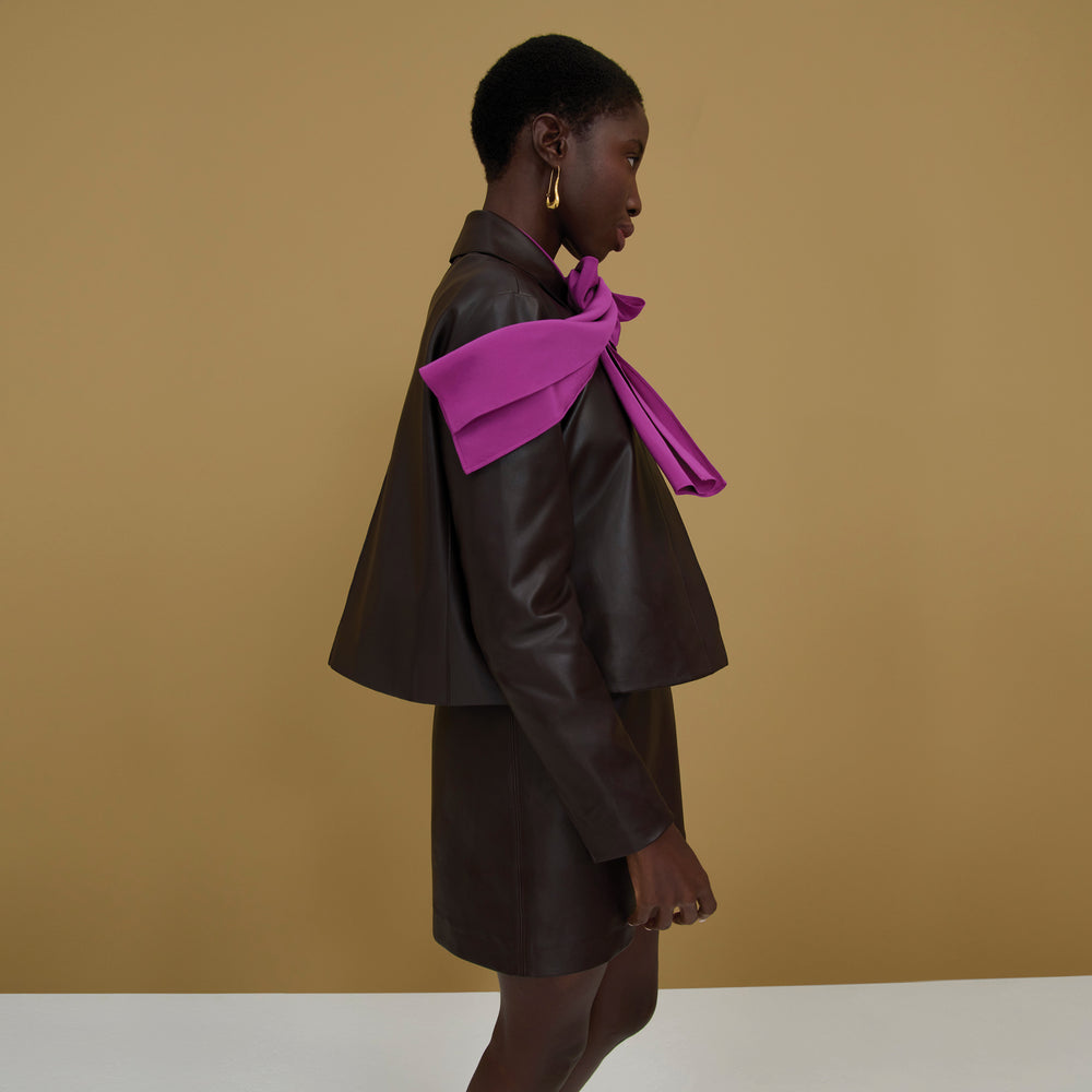 woman wearing the nicky jacket in brown