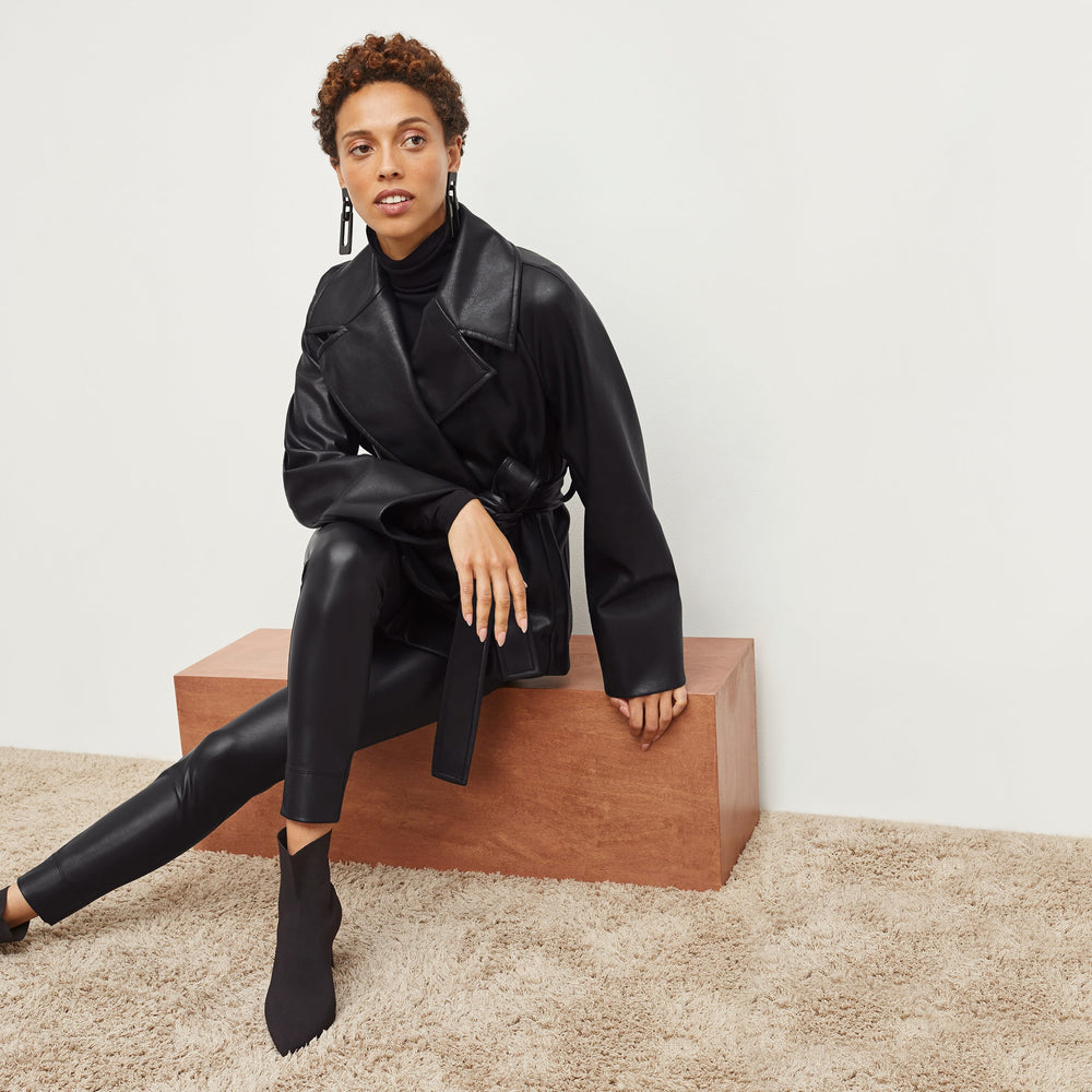 Front image of a woman standing wearing the Alphonso Jacket—Vegan Leather in Black