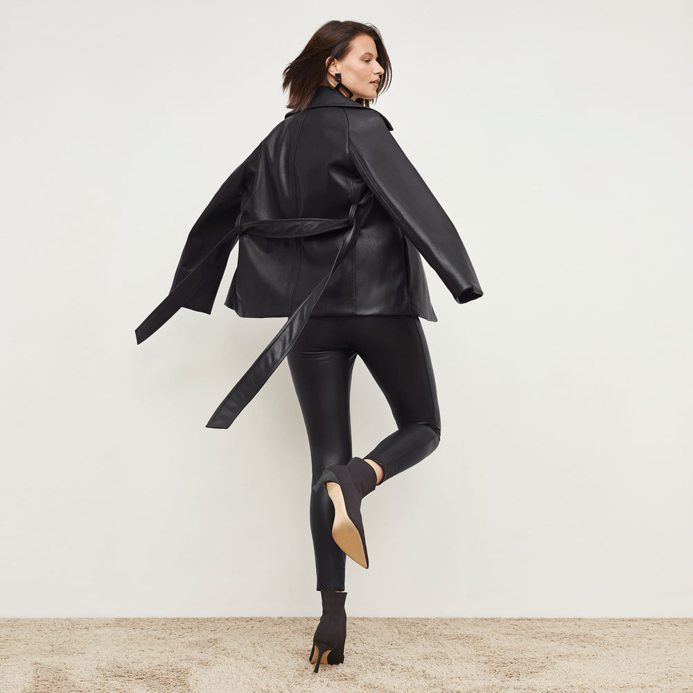 Back image of a woman standing wearing the Alphonso Jacket—Vegan Leather in Black