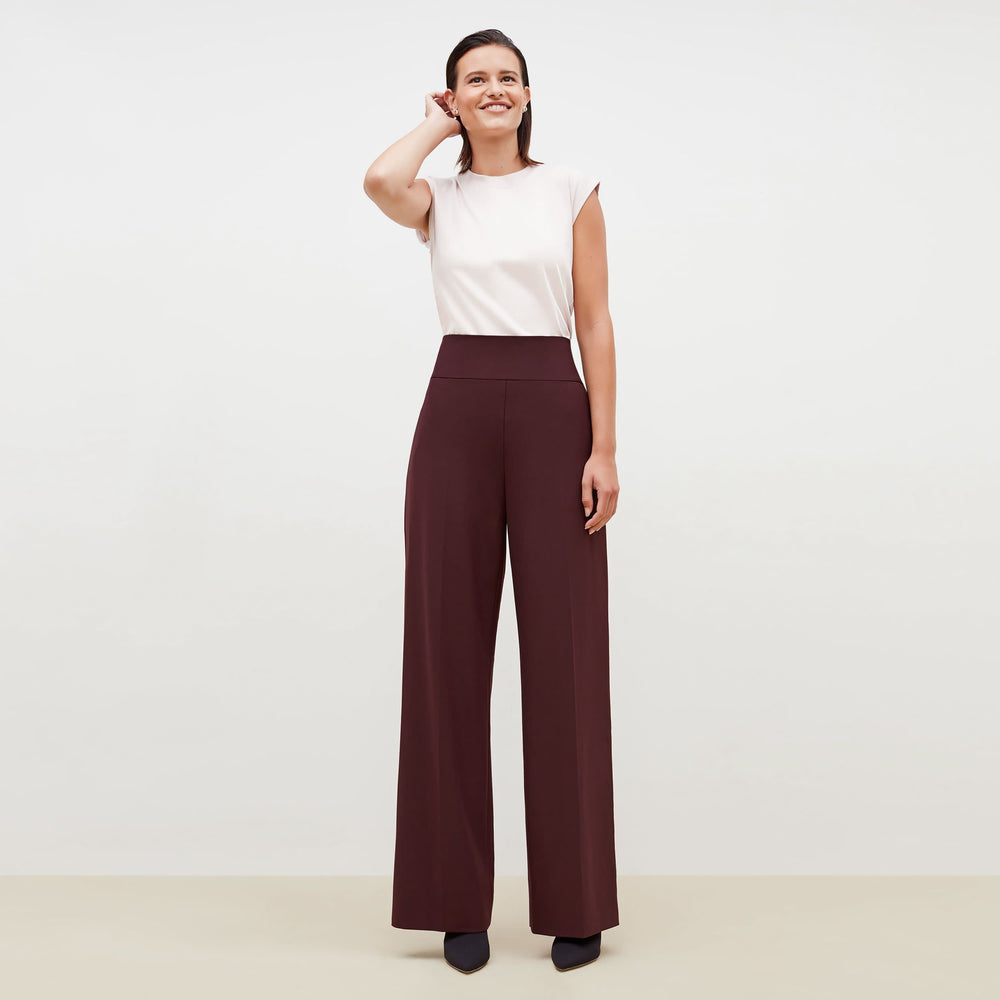 Front image of a woman standing wearing the Hadley Pant-Sharkskin in garnet